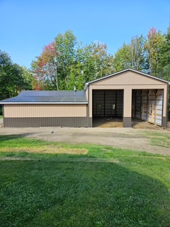 Pole barn garage with metal roof